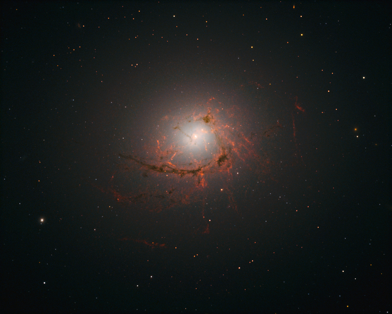 Illustration for article titled This Entire Galaxy Is Being Ravaged by Its Supermassive Black Hole
